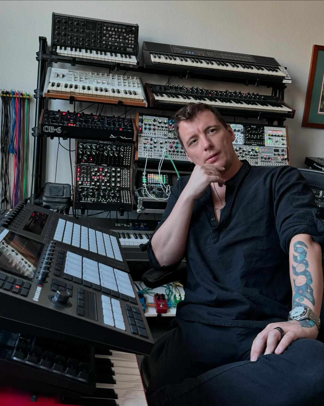 Mikhail in his studio, chin on his hand