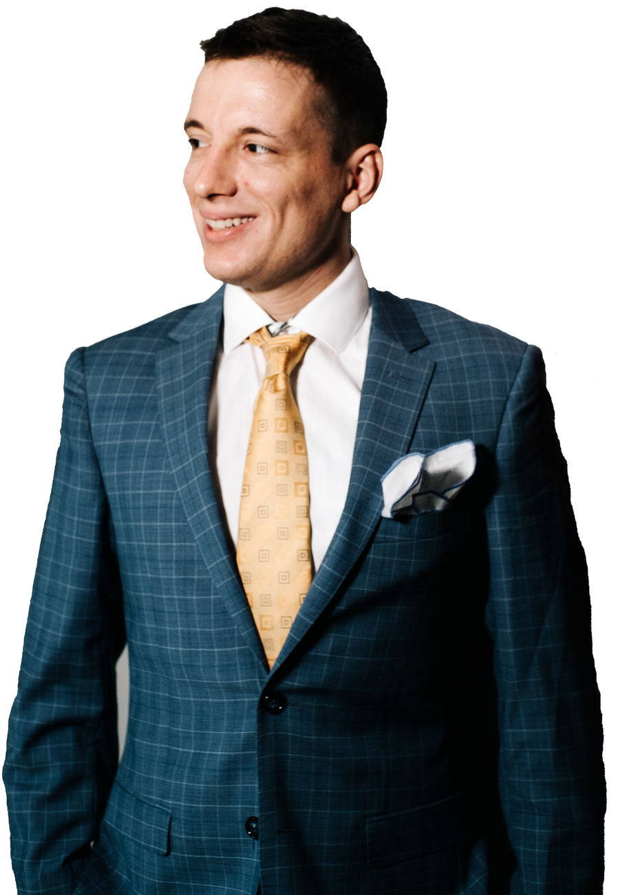 Mikhail V. Kuznetsov in a blue check suit and gold tie